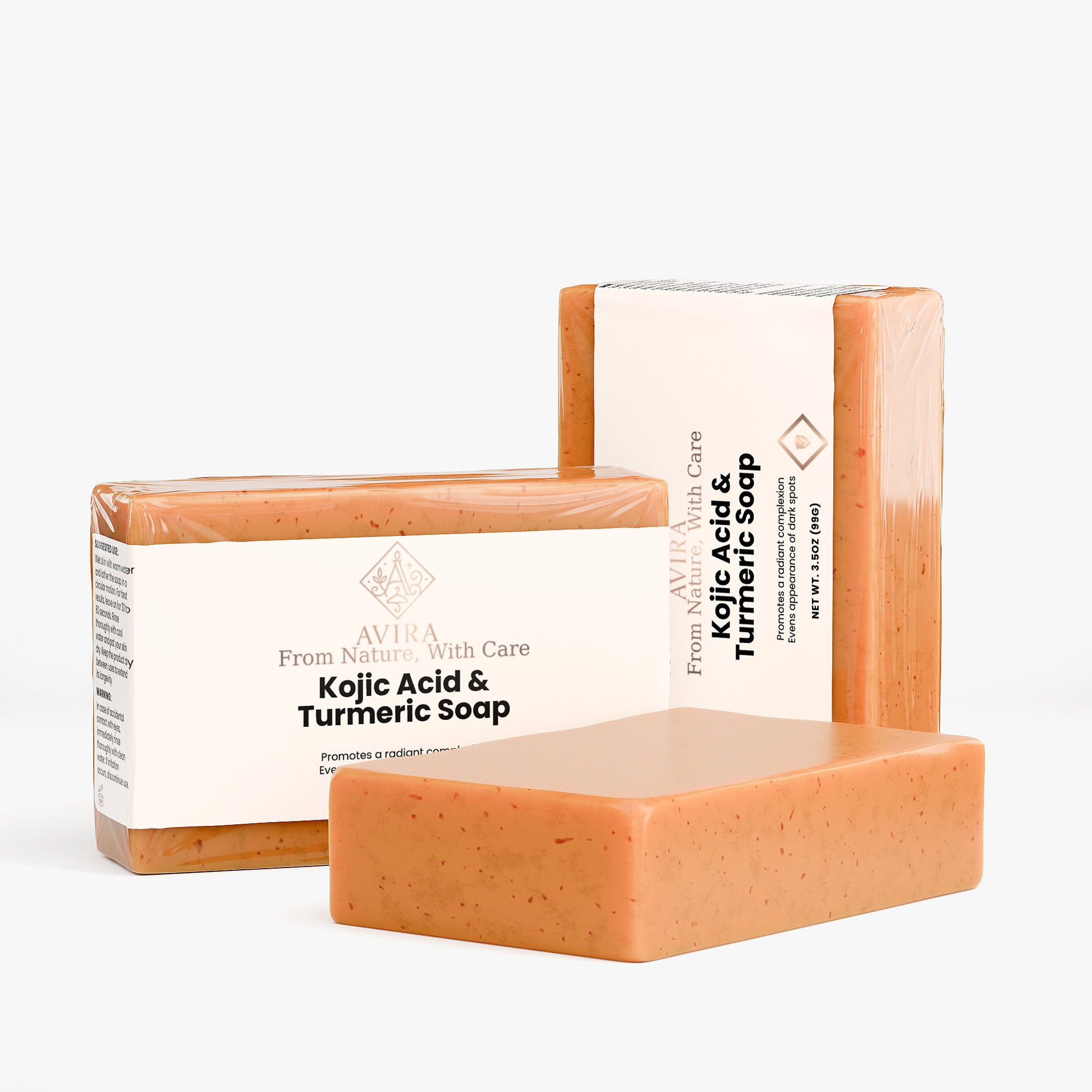 Four bars of Kojic Acid & Turmeric Soap with their packaging on a white background